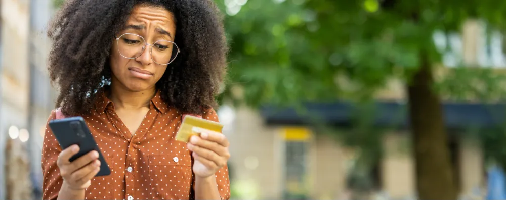 A merchant with a credit card encountering credit card decline fees.