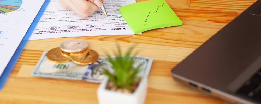 A person calculating their Tax Identification (TIN) numbers.