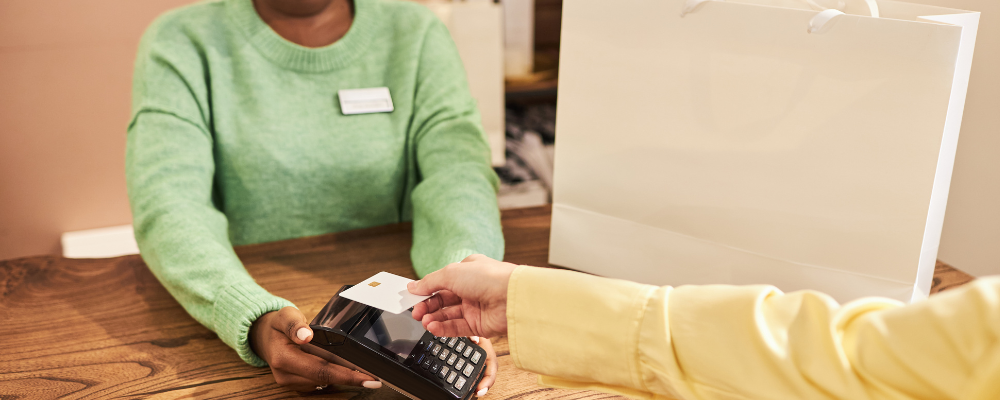 The woman is accept credit card payments