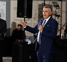 Kurv CEO Afshin speaking at a holiday party.