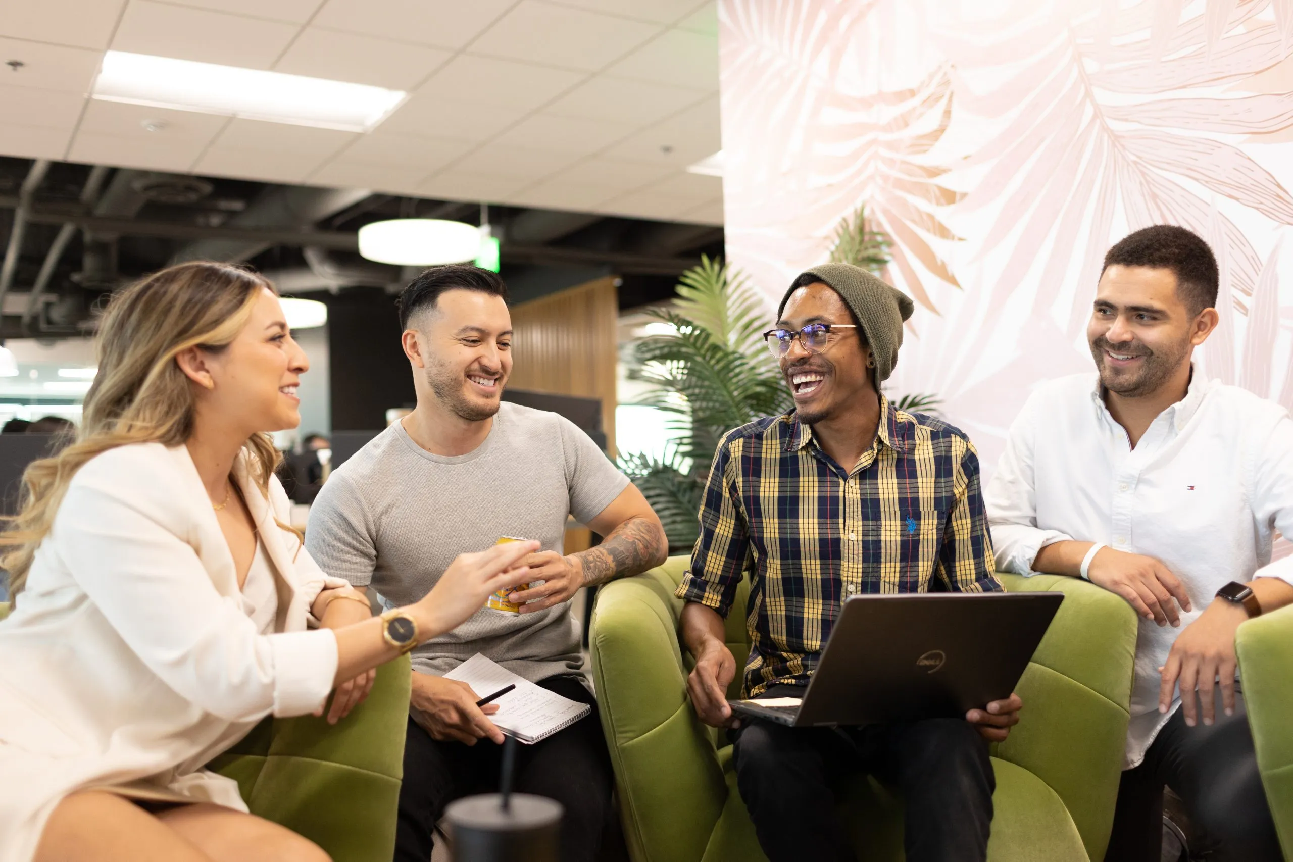 Co-workers discuss their office at Kurv.